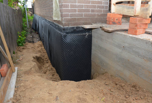 Happy homeowners after waterproofing job in Arnold
